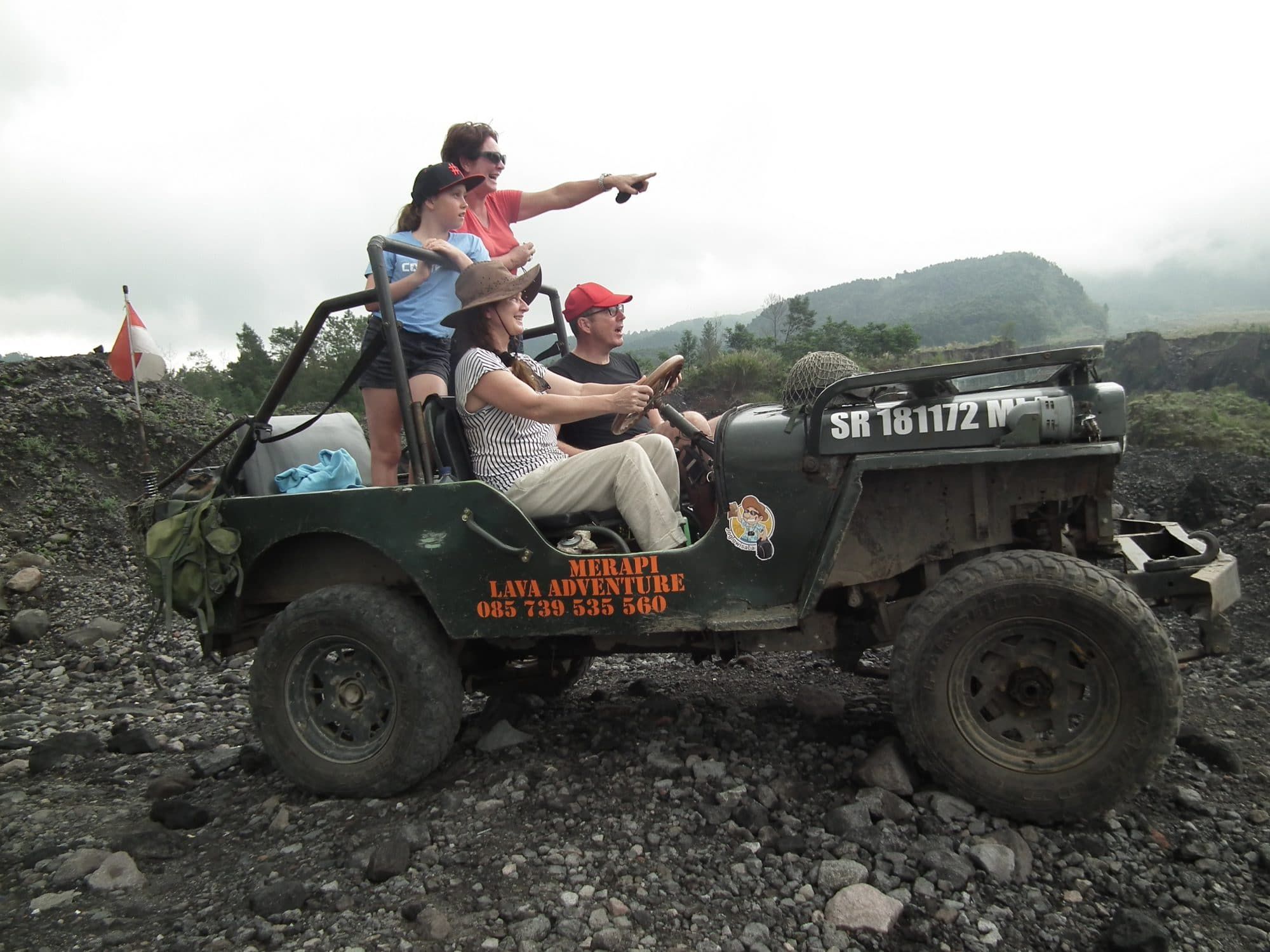 Family on a Merapi lava tour jeep safari on the volcanic slopes
