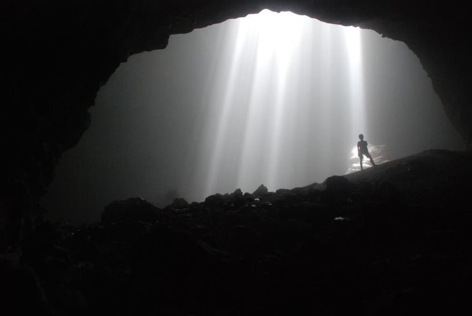 Goa Jomblang cave with dramatic light beams — a day trip from Yogyakarta