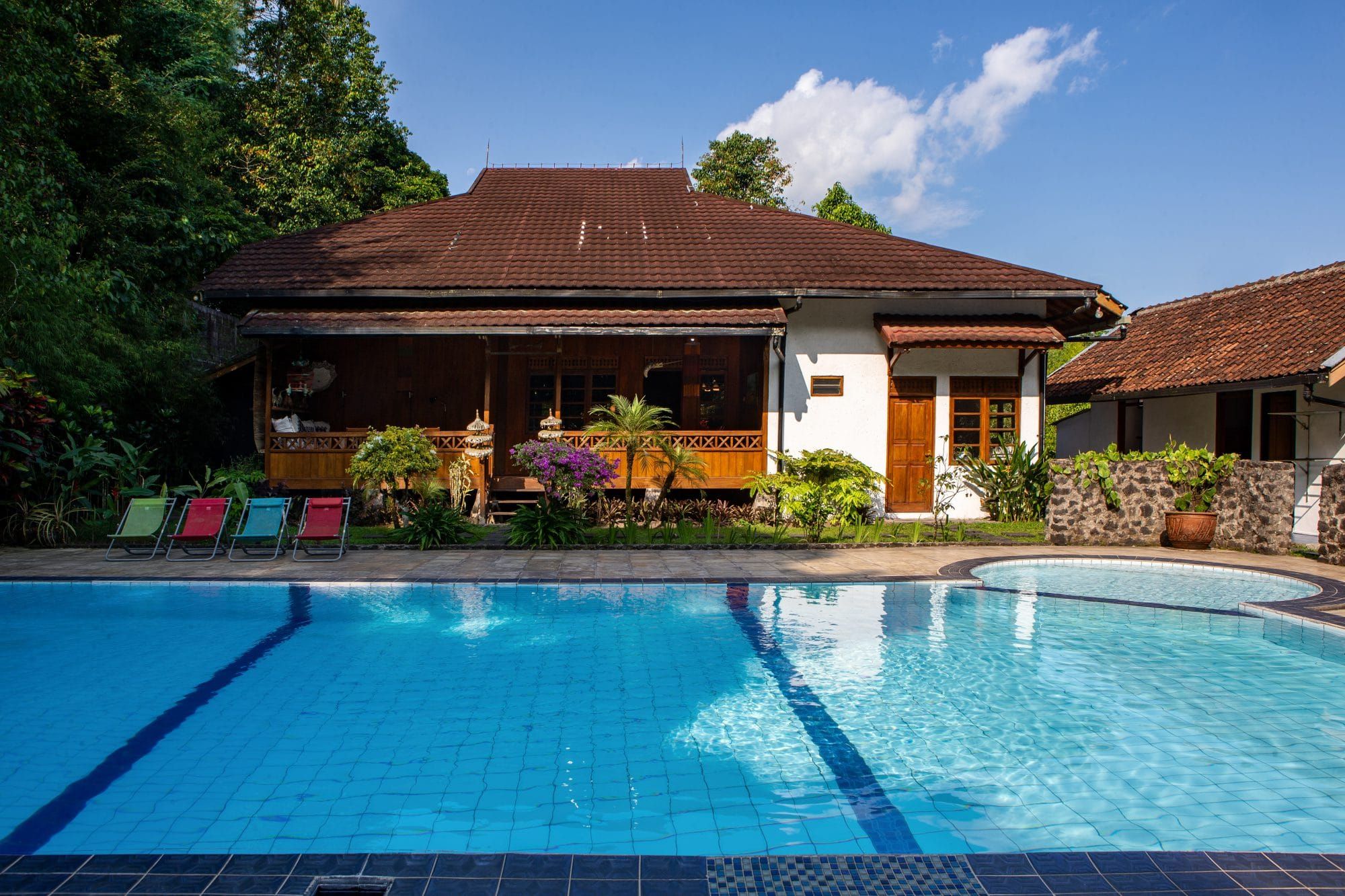 Villa Tanen with private pool and wooden veranda surrounded by tropical garden — a Dutch family's home in the village of Tanen near Yogyakarta