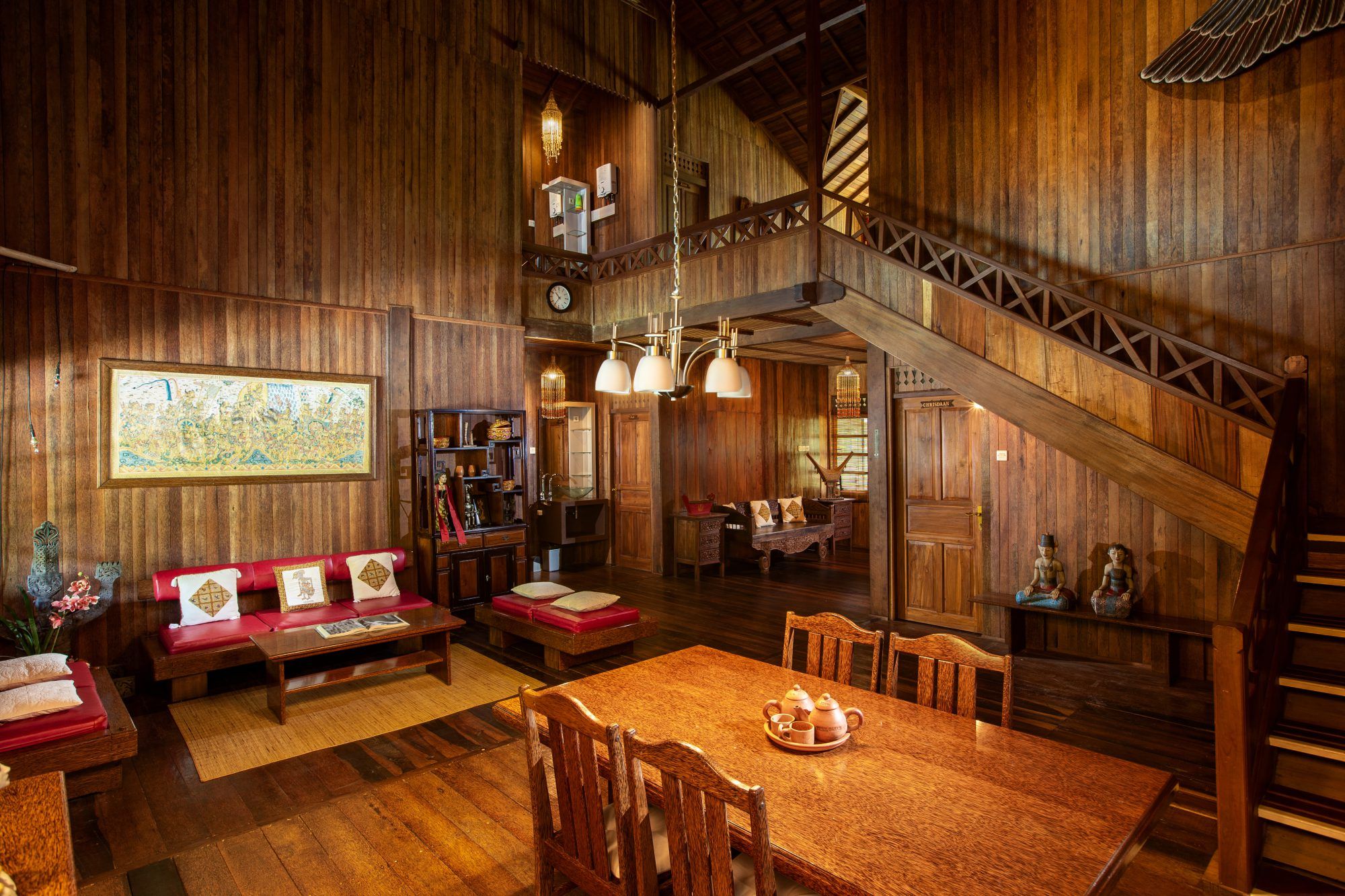 Villa Tanen veranda with teak furniture, overlooking the tropical garden