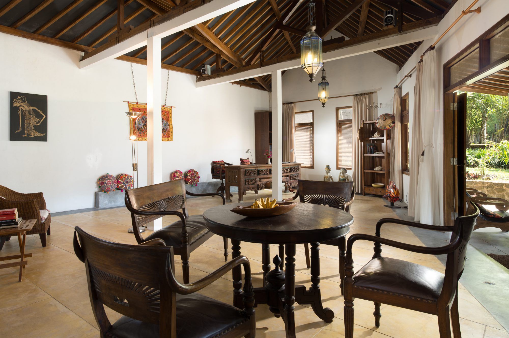 Interior of Rumah Pojok studio — sitting area with view to the garden